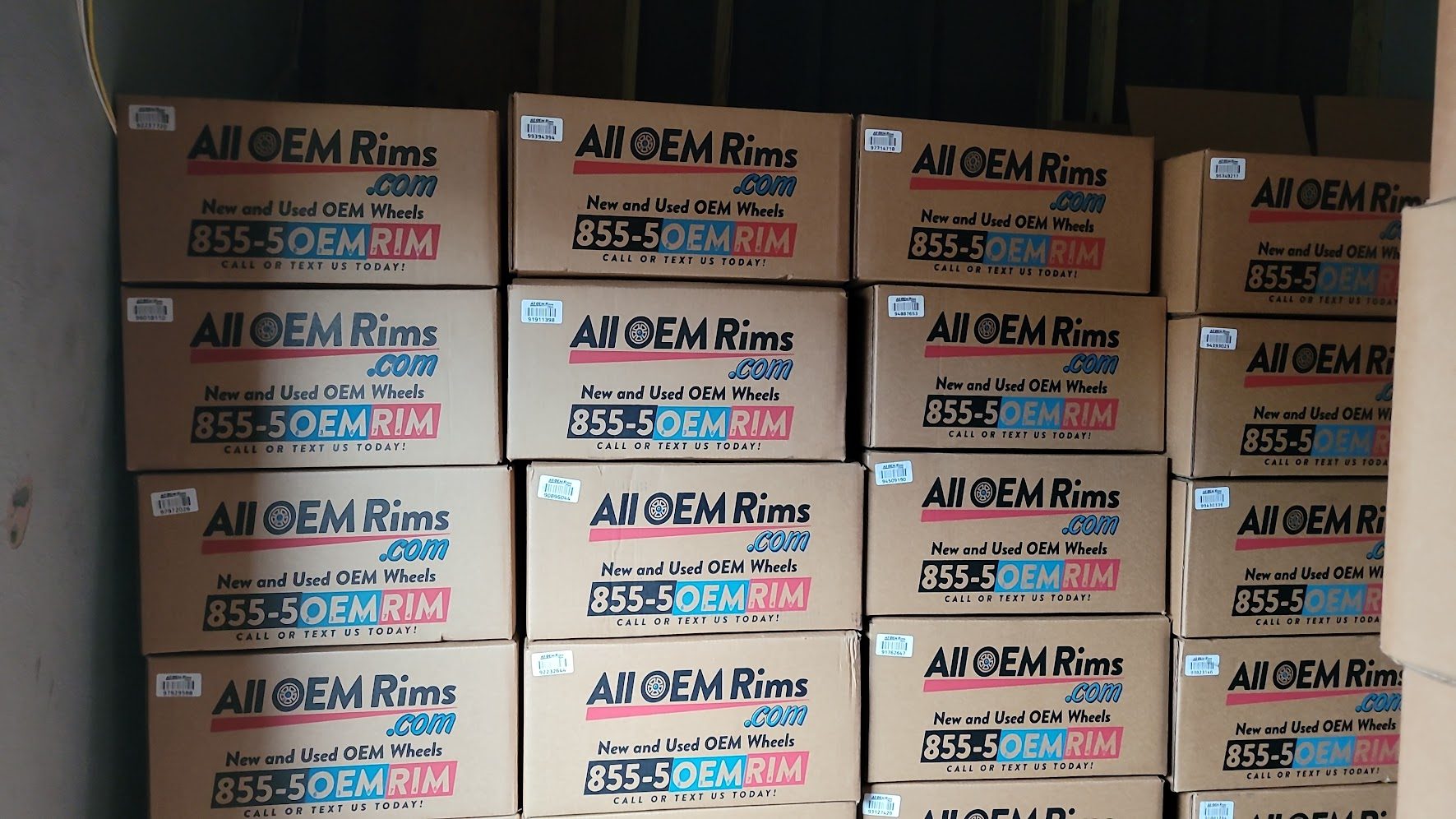 Boxed AllOEMRims wheels staged on warehouse racks by shipping zone