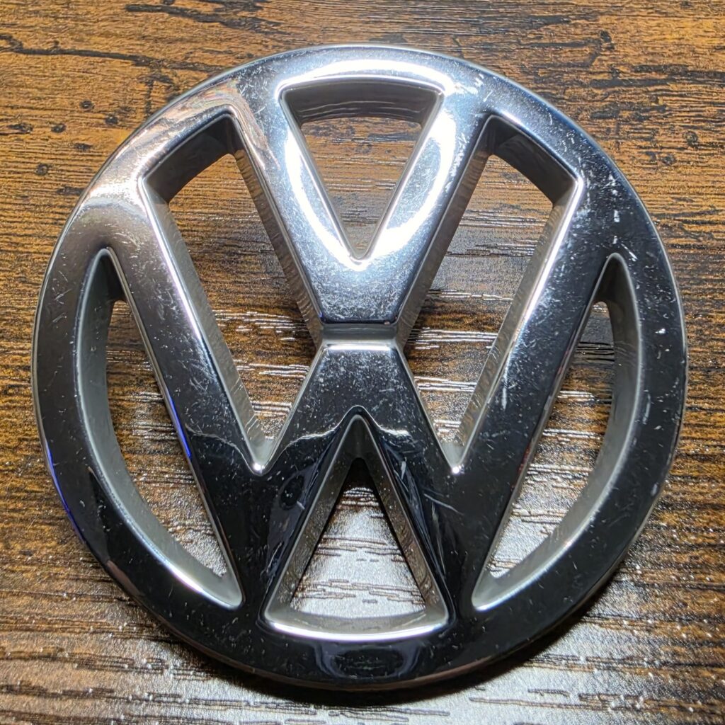 Genuine VW Rear Tailgate Emblem Badge — Passat B3 / Corrado / Polo — Chrome — OEM 357853601B